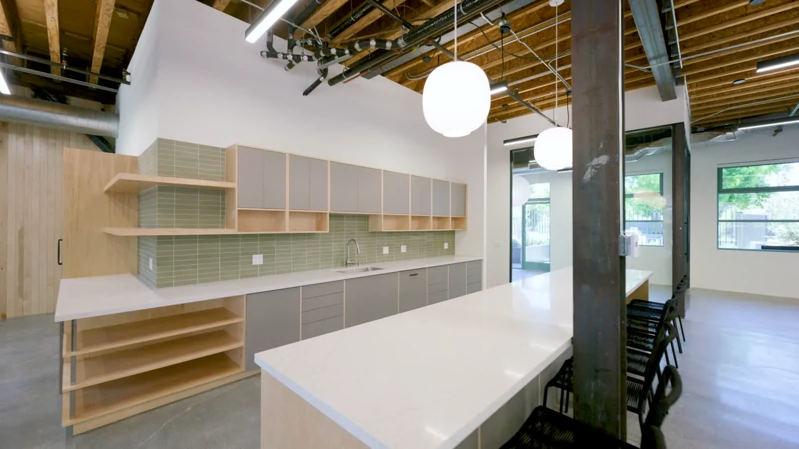 Kitchen and island under pendant lighting at 1447 Cloverfield